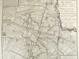 an old map of paris with a map of the city on it