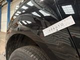a sticker on the side of a black car