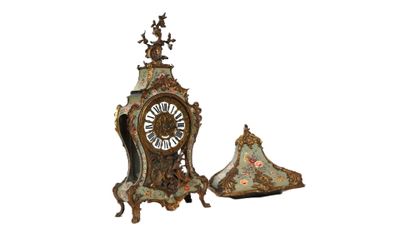 a clock that is sitting next to a clock tower