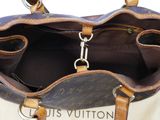 the inside of a louis vuitton handbag with two handles