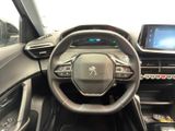 the interior of a car with a steering wheel and dashboard controls
