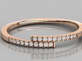 a close up of a diamond ring on a reflective surface