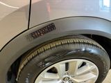 a close up of a car tire with a sticker on it