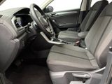 the interior of a car with a steering wheel and a dashboard