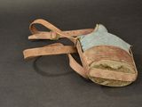 a small purse with a strap on it on a black surface