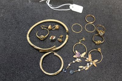 a lot of jewelry that is laying out on the table