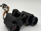 a close up of a pair of binoculars on a white surface