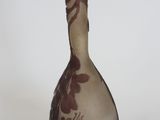 a vase that has a brown and white design on it