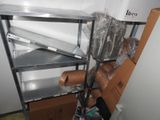 a metal shelving with a bunch of items on top of it