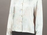 an image of a mannequin wearing a white shirt and black pants