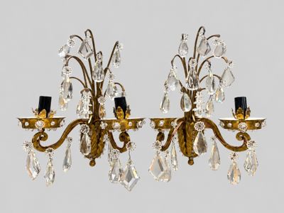 pair of brass and crystal sconces on a white background