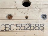 a wooden box with a hole in it that has numbers on it