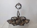 a silver plate with a candle holder on top of it