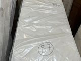 a mattress that has been wrapped up in plastic