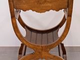 a wooden chair that is sitting in a room