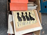 a cardboard box with a bunch of books in it