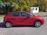a picture of a red car parked on the side of the road