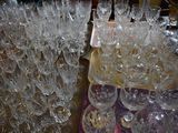 a lot of wine glasses sitting on a table