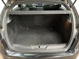 a trunk of a car with the back seats folded down