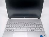an open laptop computer sitting on top of a white table