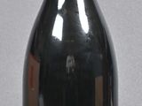 a bottle of wine that is sitting on a table
