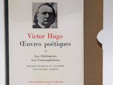 the book is sitting in front of a box with a picture of a man ' s face on it