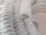 a close up of a white hose on a table