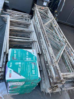 a pile of boxes and crates sitting on the ground