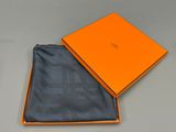 an orange box with a black and grey checkered pattern on it