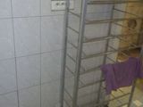 a towel rack in the corner of a bathroom