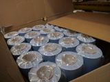 many rolls of toilet paper in a cardboard box