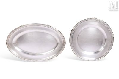pair of silver plated bowls on a white surface with a white background