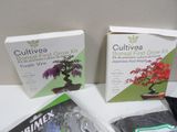 three boxes of bonsaii grow kits sitting on a table