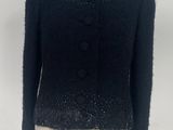 an image of a black jacket on a mannequin