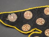 a close up of a piece of cloth with buttons on it