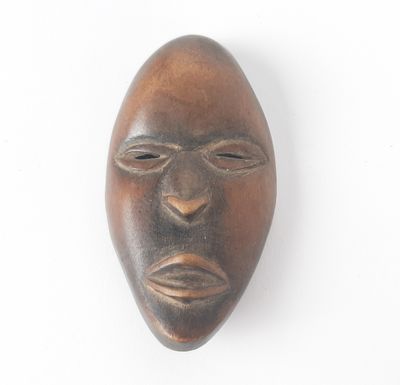 an image of a wooden mask on a white background