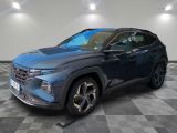 a blue 2021 toyota rav parked in a room with checkered floor