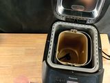 a small machine that is sitting on a wooden table