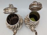 pair of antique silverplated teapots with lids and handles