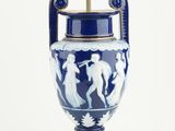 an image of a blue and white vase with a light on it