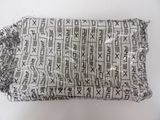 a close up of a bag with writing on it sitting on a table