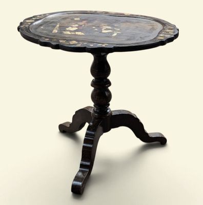 a small table with a metal tray on top of it