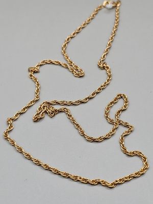an 18k gold necklace with a twisted rope design