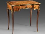 an antique writing table with two drawers and a drawer underneath it