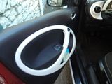 a car door with a speaker in the middle of it