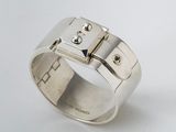 a close up of a silver ring with a lock on it