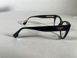 a pair of glasses sitting on a white surface
