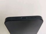 a close up of the back of a black iphone