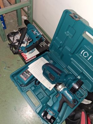 a blue tool box with tools in it on the floor