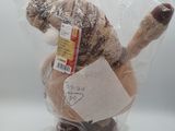 a stuffed animal that is wrapped in a plastic bag